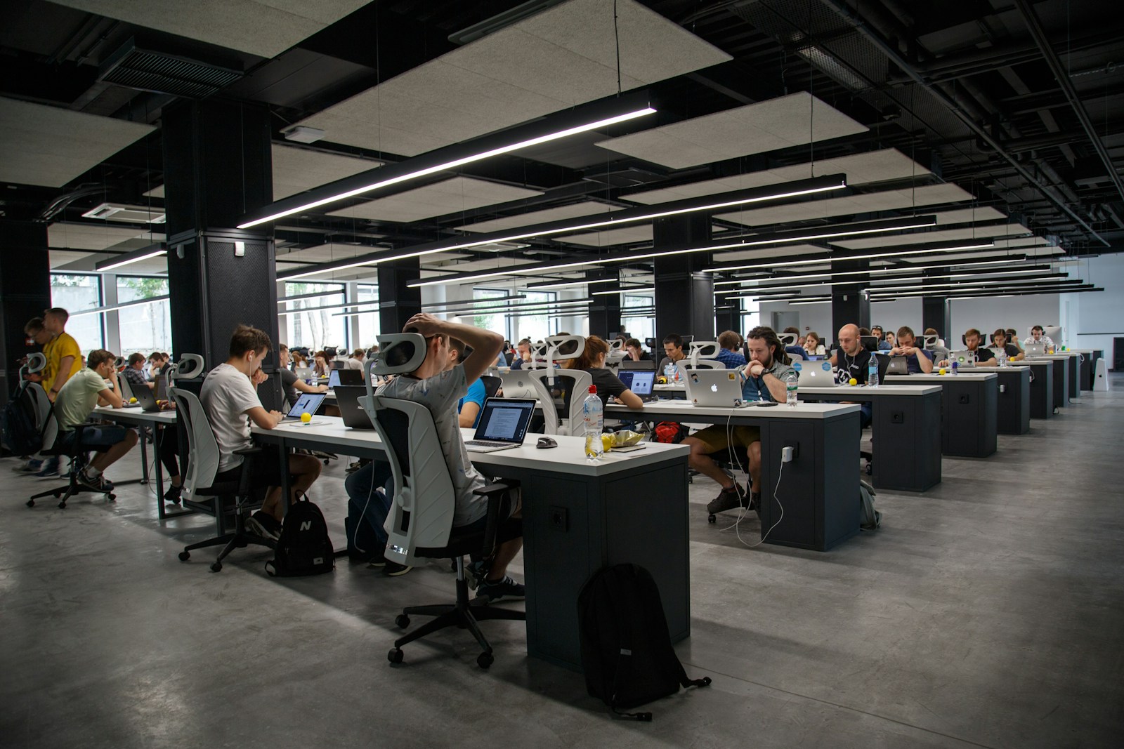 Collaborative workspace with laptops and product samples